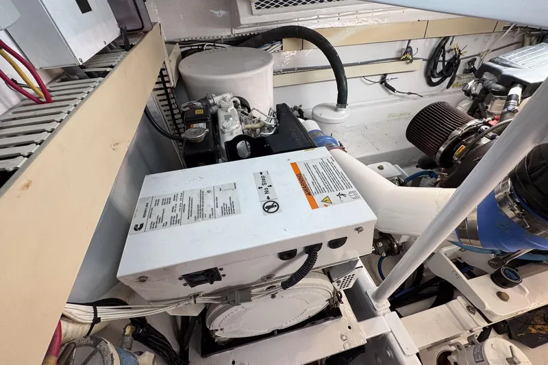 Archangel Yacht Photos Pics Engine room of a 1992 Viking 43 Open boat, showcasing mechanical components and wiring.