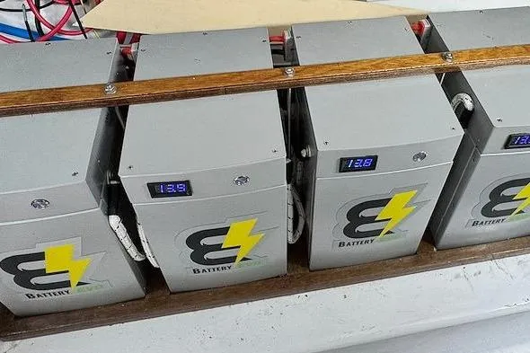 Archangel Yacht Photos Pics Battery setup on a 1992 Viking 43 Open boat, featuring digital voltage displays.