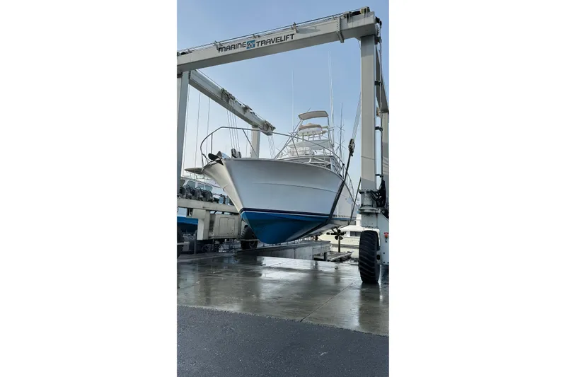 Archangel Yacht Photos Pics 1992 Viking 43 Open yacht on a Marine Travelift at a boatyard.