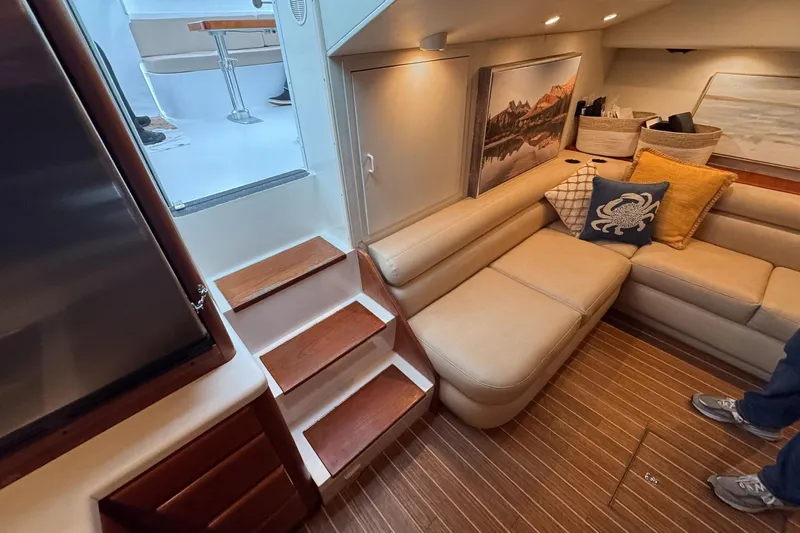 Archangel Yacht Photos Pics Luxurious interior of 1994 Viking 43 Open yacht with beige seating and wooden flooring.