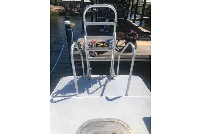  Yacht Photos Pics Newton 31 Dive Special 2014 boat with dive ladder at dockside.