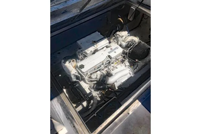  Yacht Photos Pics Engine compartment of a 2014 Newton 31 Dive Special boat, showcasing its mechanical components.