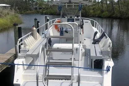  Yacht Photos Pics 2014 Newton 31 Dive Special boat docked on a calm river.