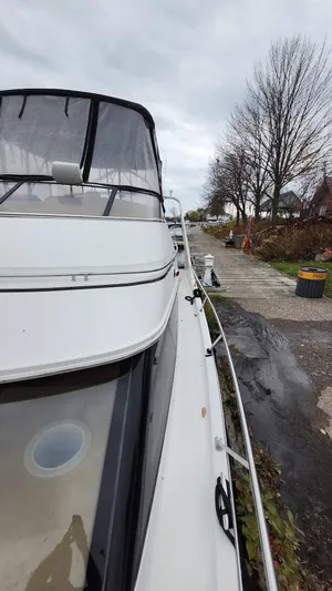  Yacht Photos Pics 2005 Carver 420 Mariner yacht docked on a cloudy day.