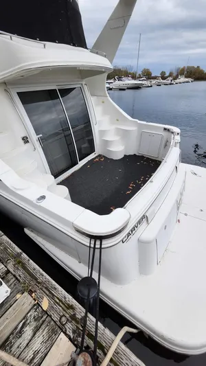  Yacht Photos Pics 2005 Carver 420 Mariner yacht docked at a marina, rear view.