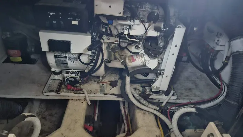  Yacht Photos Pics Engine compartment of a 2005 Carver 420 Mariner with visible wiring and components.