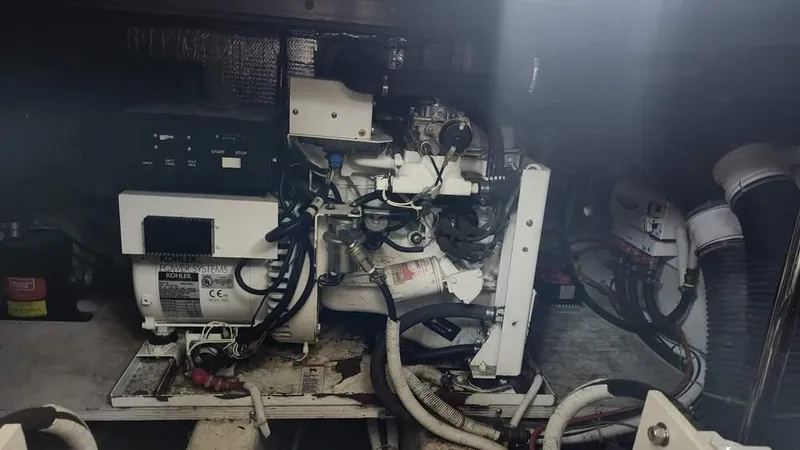  Yacht Photos Pics Engine room of 2005 Carver 420 Mariner with visible machinery and wiring.