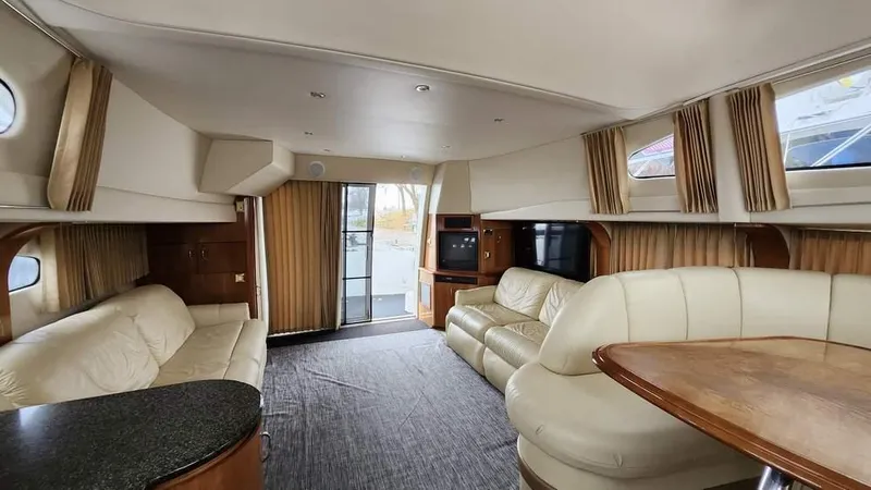  Yacht Photos Pics Luxurious interior of a 2005 Carver 420 Mariner yacht with plush seating and modern amenities.