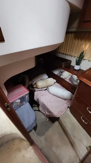  Yacht Photos Pics Cozy cabin interior of 2005 Carver 420 Mariner with bedding and storage.