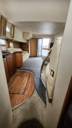  Yacht Photos Pics Interior of 2005 Carver 420 Mariner yacht, featuring elegant wood finishes and spacious layout.