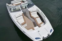 Manufacturer Provided Image: 2014 Cobalt 26SD boat with white and tan interior on water.