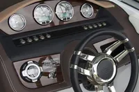 Manufacturer Provided Image: 2014 Cobalt 26SD boat dashboard with gauges and steering wheel.