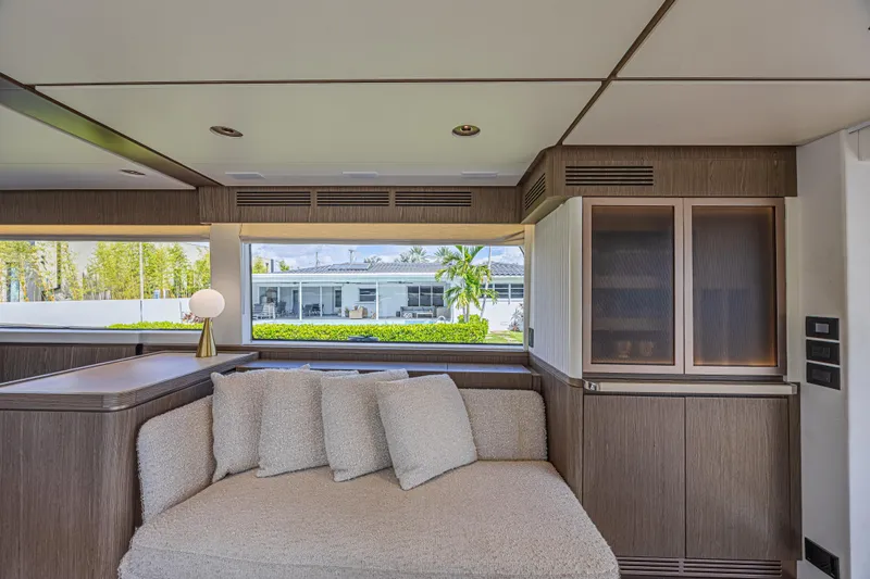  Yacht Photos Pics Luxurious interior of 2022 Azimut Magellano 66 yacht with modern furnishings and large windows.