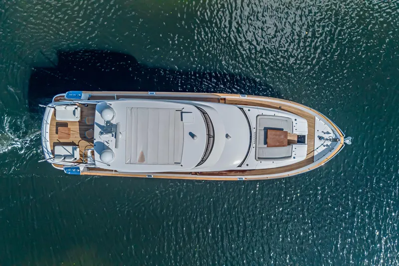  Yacht Photos Pics Top view of 2022 Azimut Magellano 66 yacht cruising on water.