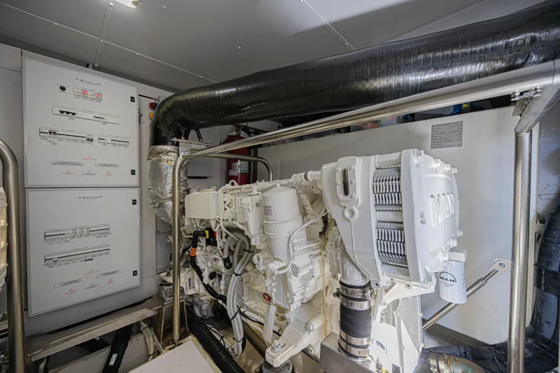  Yacht Photos Pics Engine room of 2022 Azimut Magellano 66 yacht, featuring advanced machinery and control panels.