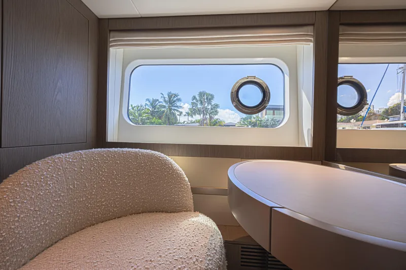  Yacht Photos Pics Luxurious interior of 2022 Azimut Magellano 66 yacht with scenic window view.