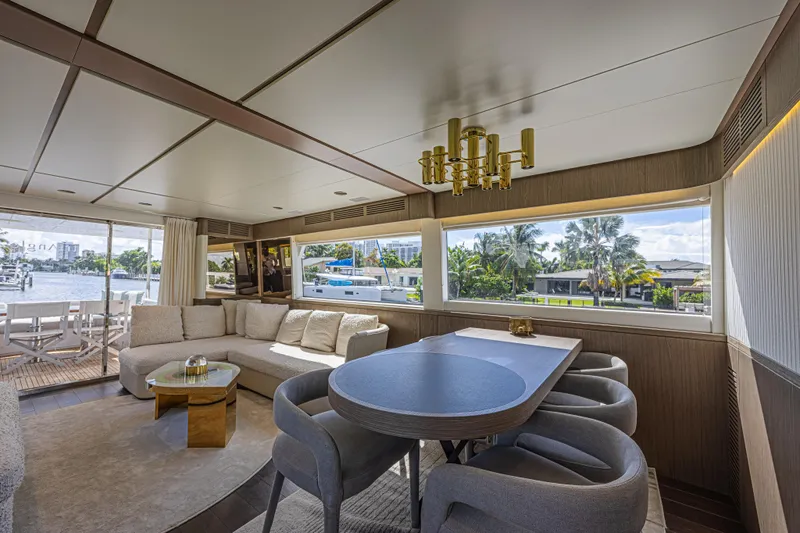  Yacht Photos Pics Luxurious interior of 2022 Azimut Magellano 66 yacht with elegant seating and large windows.