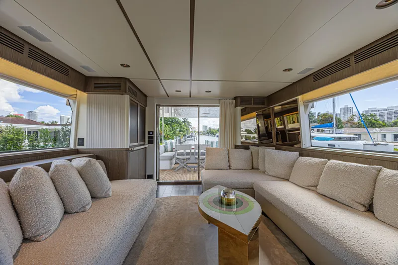  Yacht Photos Pics Luxurious interior of 2022 Azimut Magellano 66 yacht with plush seating and modern decor.