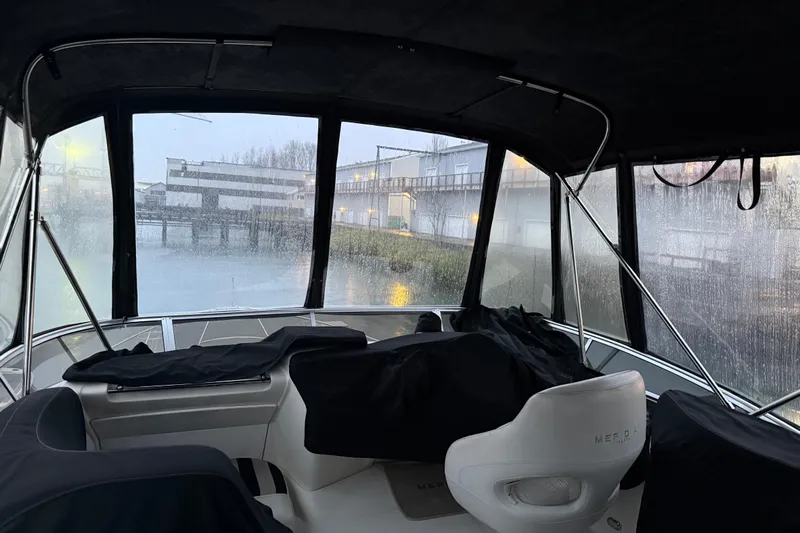  Yacht Photos Pics Interior view of 2005 Meridian 368 Motoryacht with misty windows and dockside scenery.