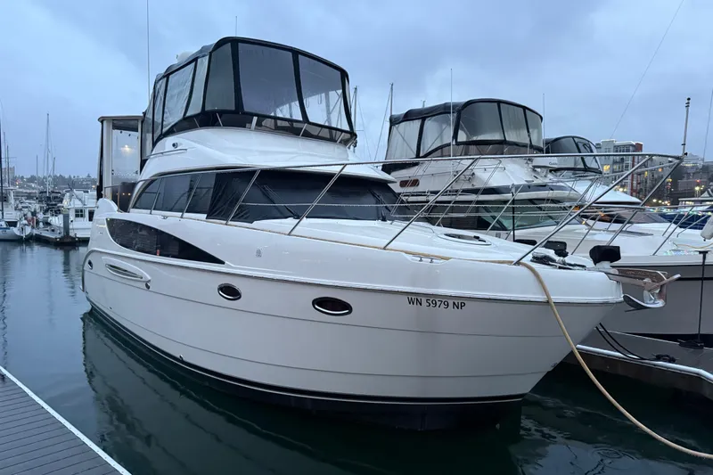  Yacht Photos Pics 2005 Meridian 368 Motoryacht docked at marina, overcast sky, calm water.