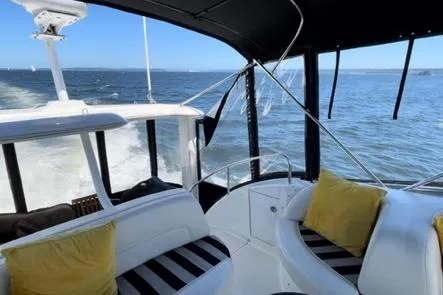  Yacht Photos Pics 2005 Meridian 368 Motoryacht interior with ocean view, featuring comfortable seating and stylish design.