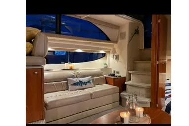  Yacht Photos Pics Luxurious interior of a 2005 Meridian 368 Motoryacht with cozy seating and ambient lighting.