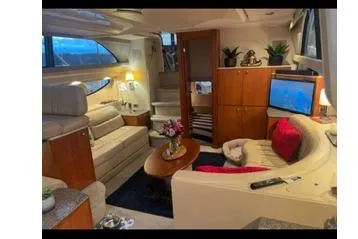  Yacht Photos Pics Luxurious interior of 2005 Meridian 368 Motoryacht with cozy seating and elegant decor.