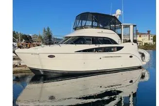  Yacht Photos Pics 2005 Meridian 368 Motoryacht docked on calm water under clear blue sky.