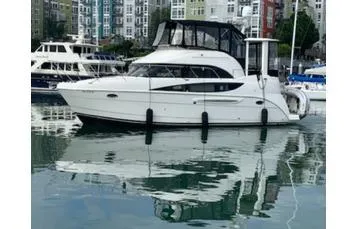  Yacht Photos Pics 2005 Meridian 368 Motoryacht docked in a marina, reflecting on calm water.
