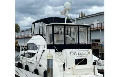  Yacht Photos Pics 2005 Meridian 368 Motoryacht docked, featuring a covered upper deck and radar equipment.