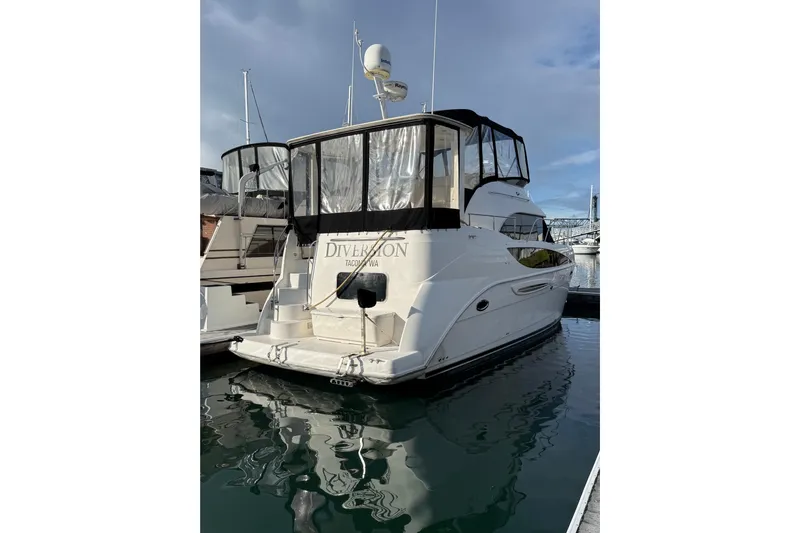  Yacht Photos Pics 2005 Meridian 368 Motoryacht docked, featuring a sleek design and spacious deck area.