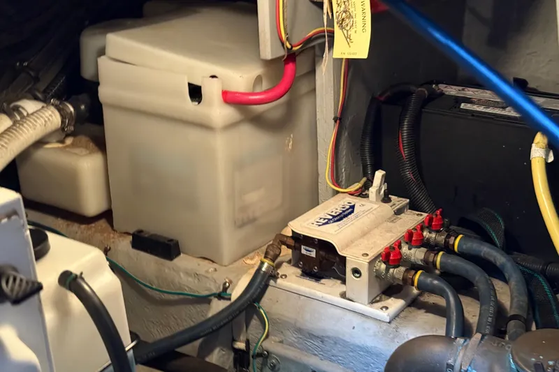  Yacht Photos Pics Engine compartment of a 2005 Meridian 368 Motoryacht, featuring wiring and fluid containers.