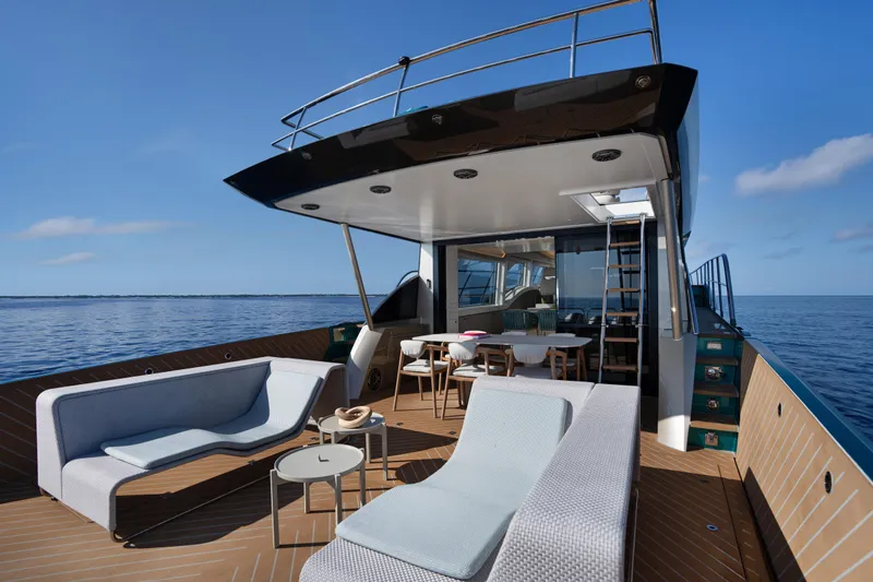 Edge 65 Yacht Photos Pics Luxurious 2023 Van der Valk Edge 65 yacht deck with modern seating and ocean view.