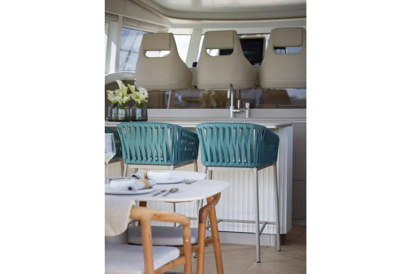 Edge 65 Yacht Photos Pics Luxurious interior of 2023 Van der Valk Edge 65 yacht with elegant seating and dining area.