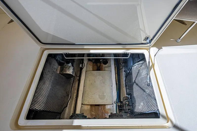 Miss Betty Yacht Photos Pics Open engine compartment of 2002 Hinckley Talaria 40 boat, showcasing internal components.