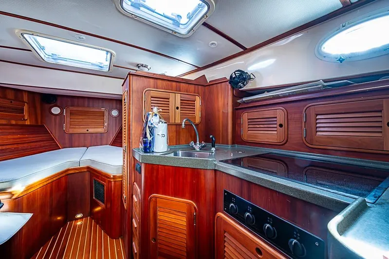 Miss Betty Yacht Photos Pics Luxurious 2002 Hinckley Talaria 40 yacht interior with wood finish and modern amenities.