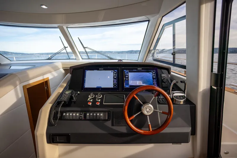 Tui Yacht Photos Pics Helm of 2023 Greenline 48 Fly yacht with modern navigation equipment.
