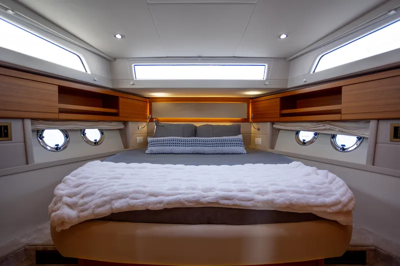 Tui Yacht Photos Pics Luxurious cabin interior of 2023 Greenline 48 Fly yacht with cozy bedding.