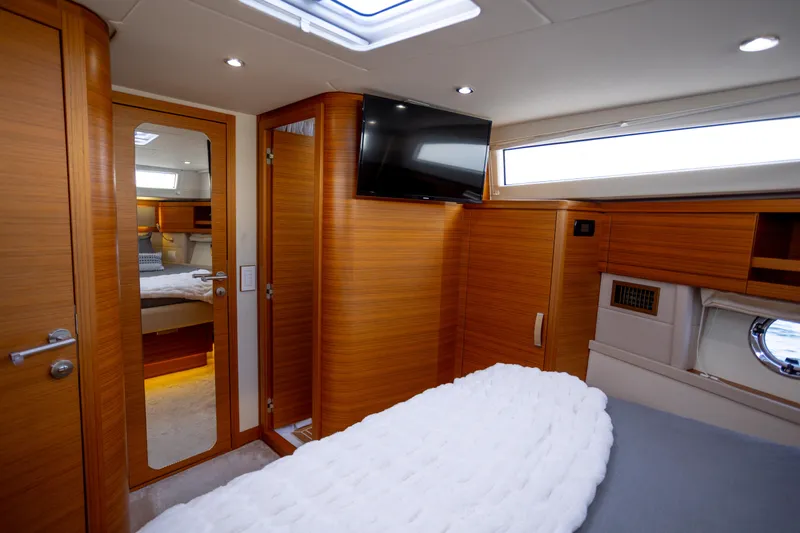 Tui Yacht Photos Pics Luxurious interior of 2023 Greenline 48 Fly yacht with wood paneling and modern amenities.
