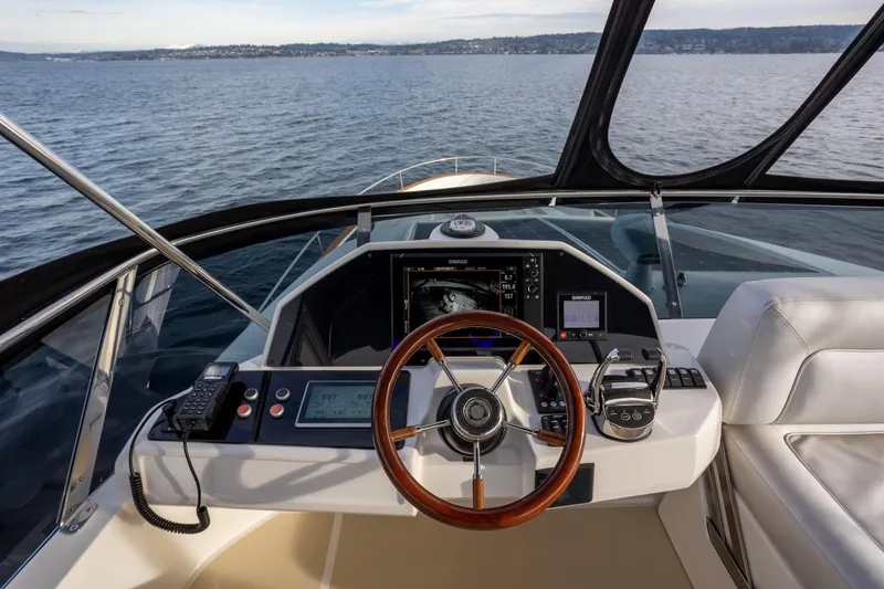 Tui Yacht Photos Pics Helm of 2023 Greenline 48 Fly yacht with modern navigation equipment.