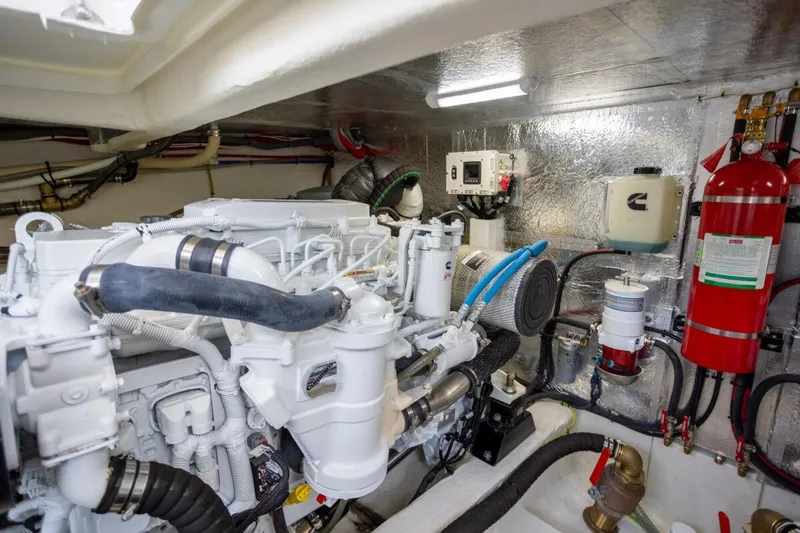 Tui Yacht Photos Pics Engine room of 2023 Greenline 48 Fly yacht, featuring modern equipment and fire extinguisher.