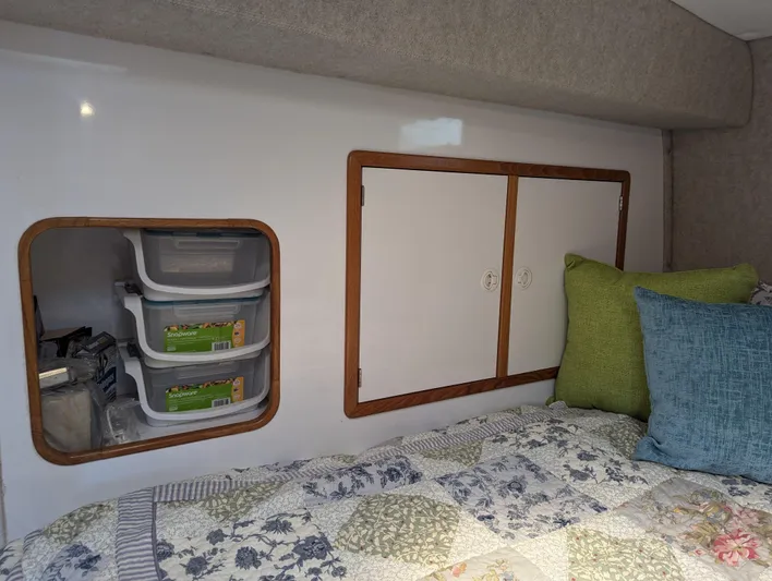  Yacht Photos Pics Interior cabin of 2000 Manta 42 with storage and bedding.