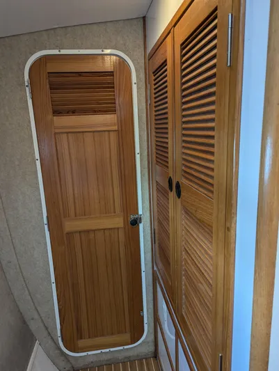  Yacht Photos Pics Wooden interior door and closet on a 2000 Manta 42 boat.