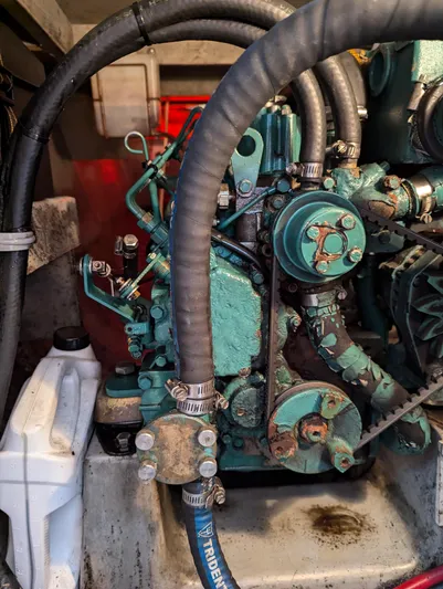  Yacht Photos Pics Engine compartment of a 2000 Manta 42 sailboat, featuring hoses and mechanical components.