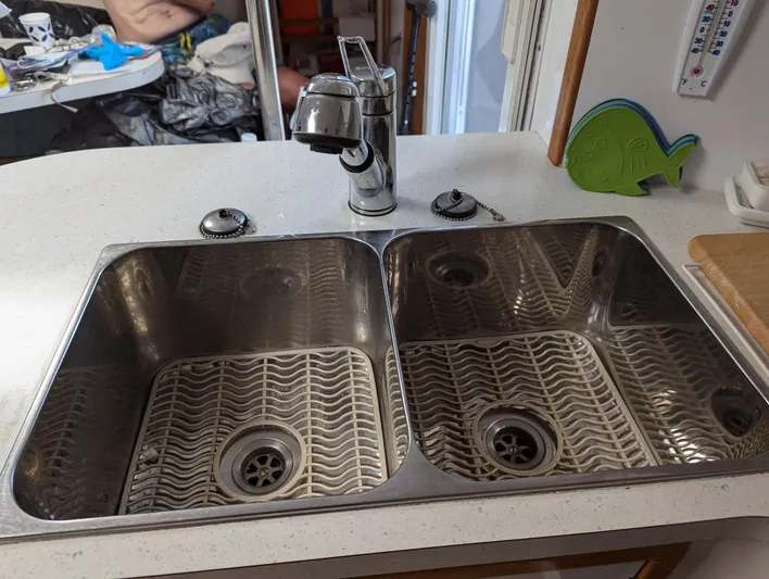  Yacht Photos Pics Stainless steel double sink with modern faucet on a Manta 42 yacht, 2000 model.