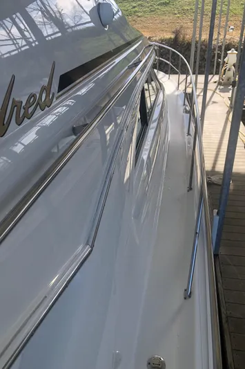 Callie B Yacht Photos Pics 2001 Sea Ray 400 Sedan Bridge yacht, side view with sleek design and docked setting.