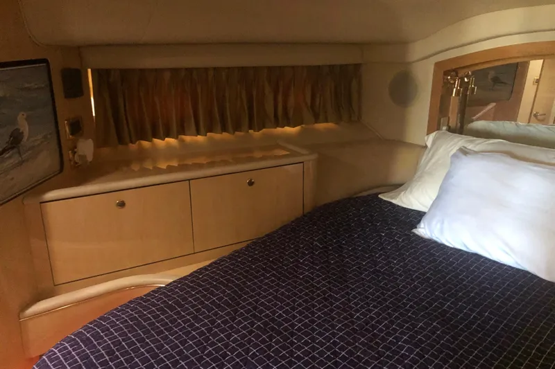 Callie B Yacht Photos Pics Interior cabin of 2001 Sea Ray 400 Sedan Bridge with bed and storage.