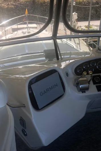 Callie B Yacht Photos Pics 2001 Sea Ray 400 Sedan Bridge helm with Garmin navigation system.