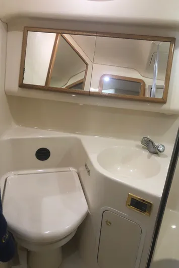 Callie B Yacht Photos Pics 2001 Sea Ray 400 Sedan Bridge bathroom with sink, mirror, and toilet.