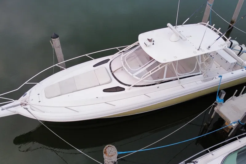  Yacht Photos Pics 2001 Intrepid 377 Walkaround boat docked in calm waters, aerial view.